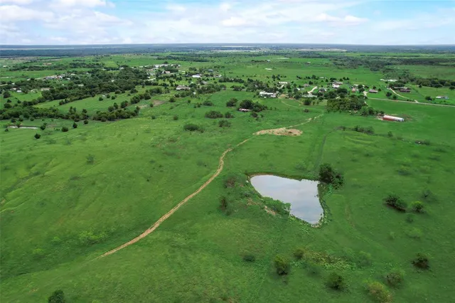 a view of a green field with clear sky