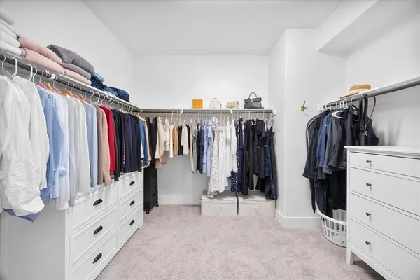 a bathroom with a sink vanity and a shower