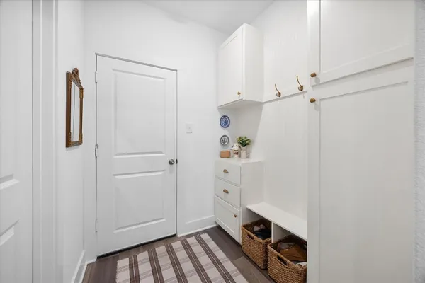 a bathroom with a sink mirror and toilet