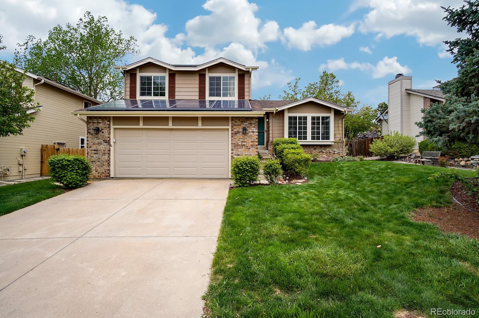 417 Ridgeglen Way Highlands Ranch, CO 80126 - Photo 1 of 33 a front view of a house with garden