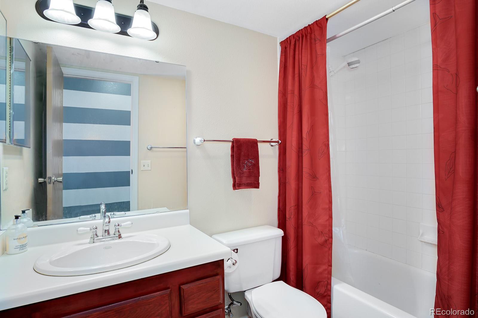417 Ridgeglen Way Highlands Ranch, CO 80126 - Photo 22 of 33 a bathroom with a sink vanity mirror and toilet