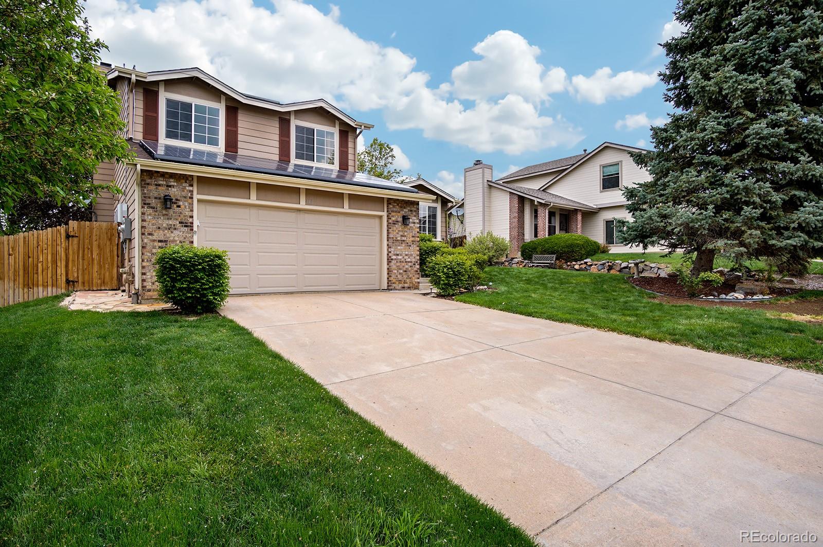 417 Ridgeglen Way Highlands Ranch, CO 80126 - Photo 32 of 33 a front view of a house with a yard and garage