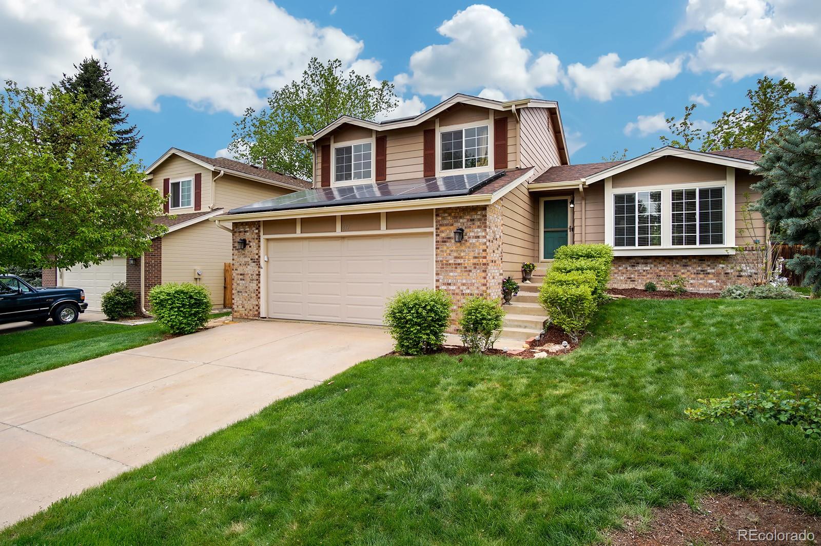 417 Ridgeglen Way Highlands Ranch, CO 80126 - Photo 33 of 33 a front view of a house with a yard and garage