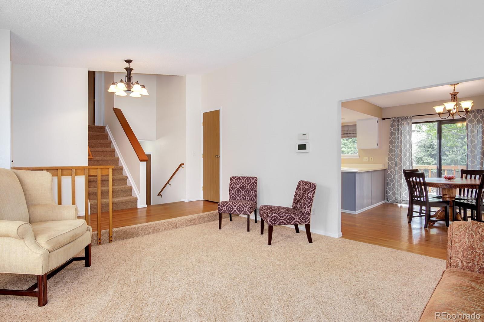 417 Ridgeglen Way Highlands Ranch, CO 80126 - Photo 4 of 33 a living room with furniture and a large window