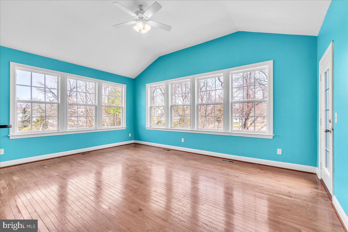 9588 Clover Hill Road Manassas, VA 20110 - Photo 16 of 32 a view of an empty room with window and chandelier fan