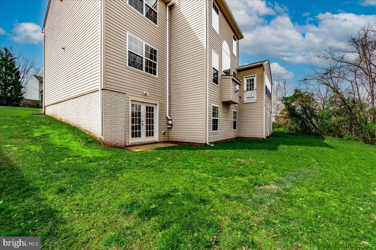 9588 Clover Hill Road Manassas, VA 20110 - Photo 2 of 32 a view of a back yard of the house