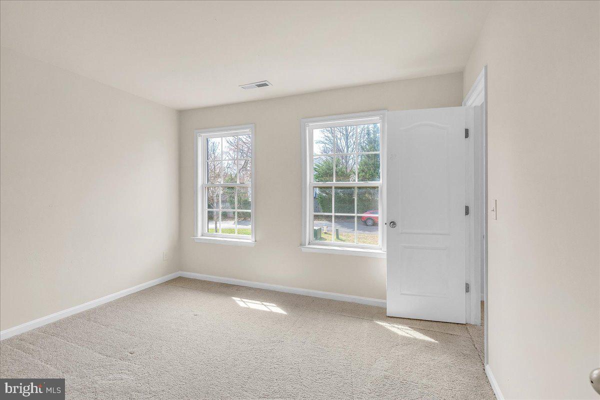 9588 Clover Hill Road Manassas, VA 20110 - Photo 23 of 32 an empty room with windows