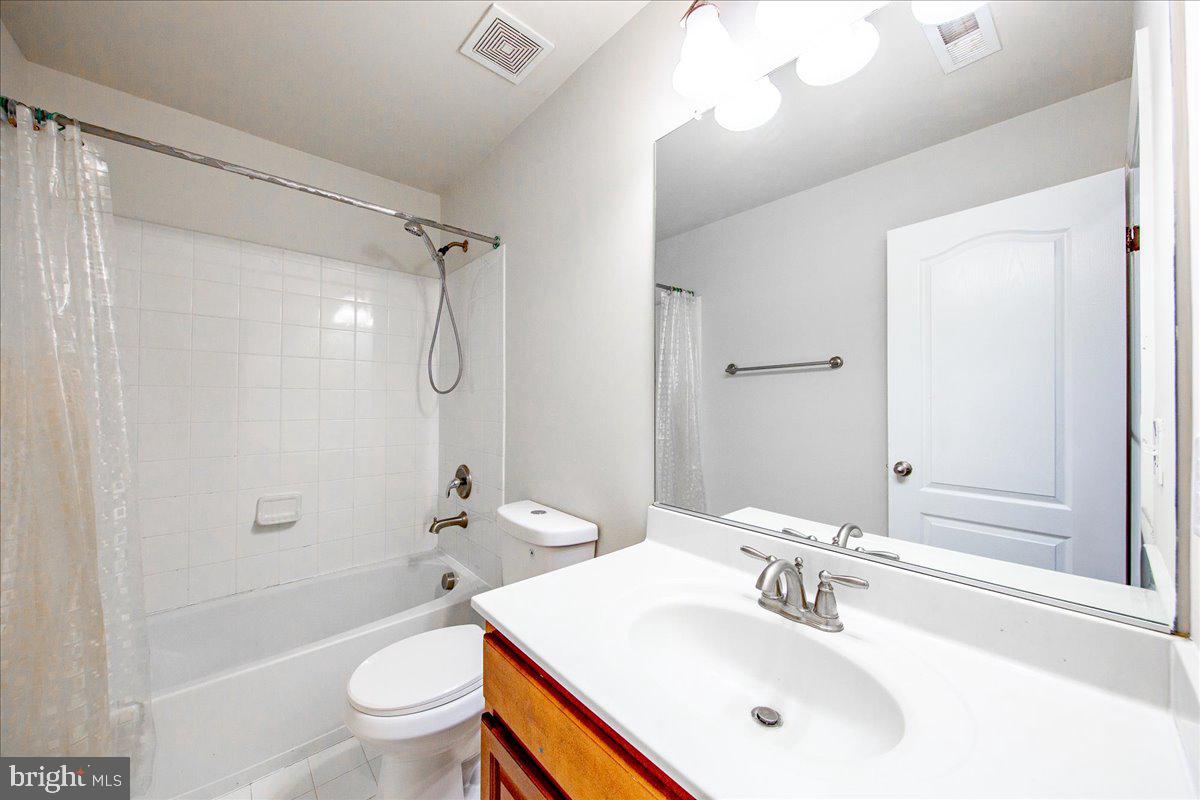 9588 Clover Hill Road Manassas, VA 20110 - Photo 27 of 32 a bathroom with a sink toilet and shower