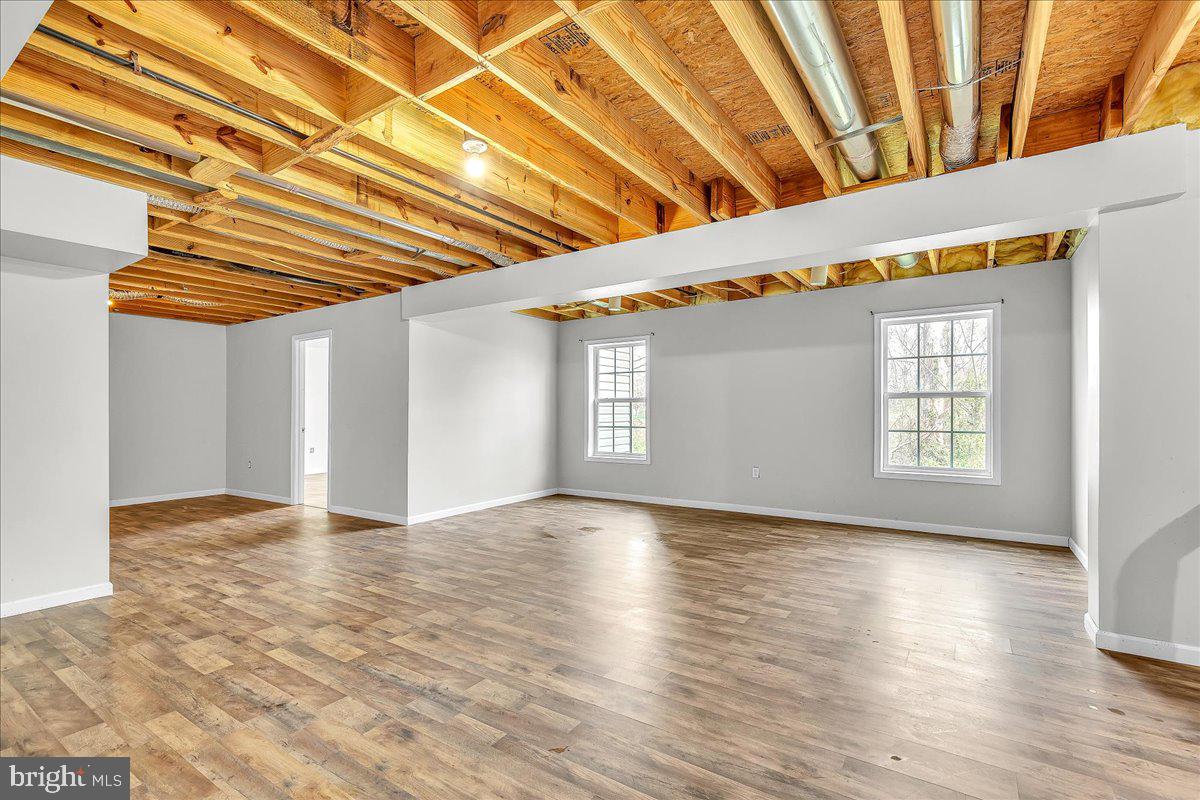 9588 Clover Hill Road Manassas, VA 20110 - Photo 29 of 32 a view of room with window and wooden floor