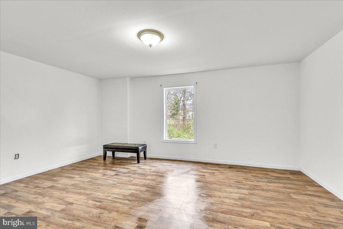 9588 Clover Hill Road Manassas, VA 20110 - Photo 31 of 32 wooden floor in an empty room with a window