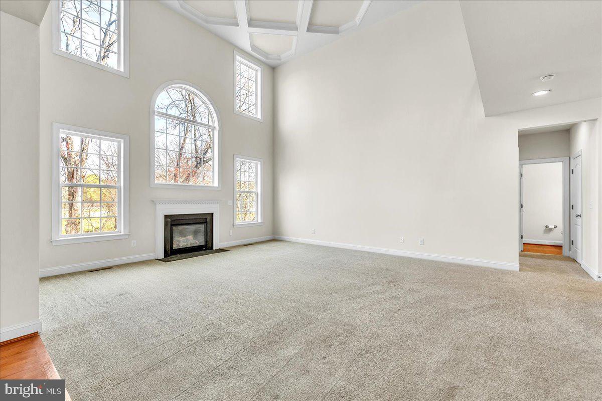 9588 Clover Hill Road Manassas, VA 20110 - Photo 6 of 32 an empty room with windows and fireplace