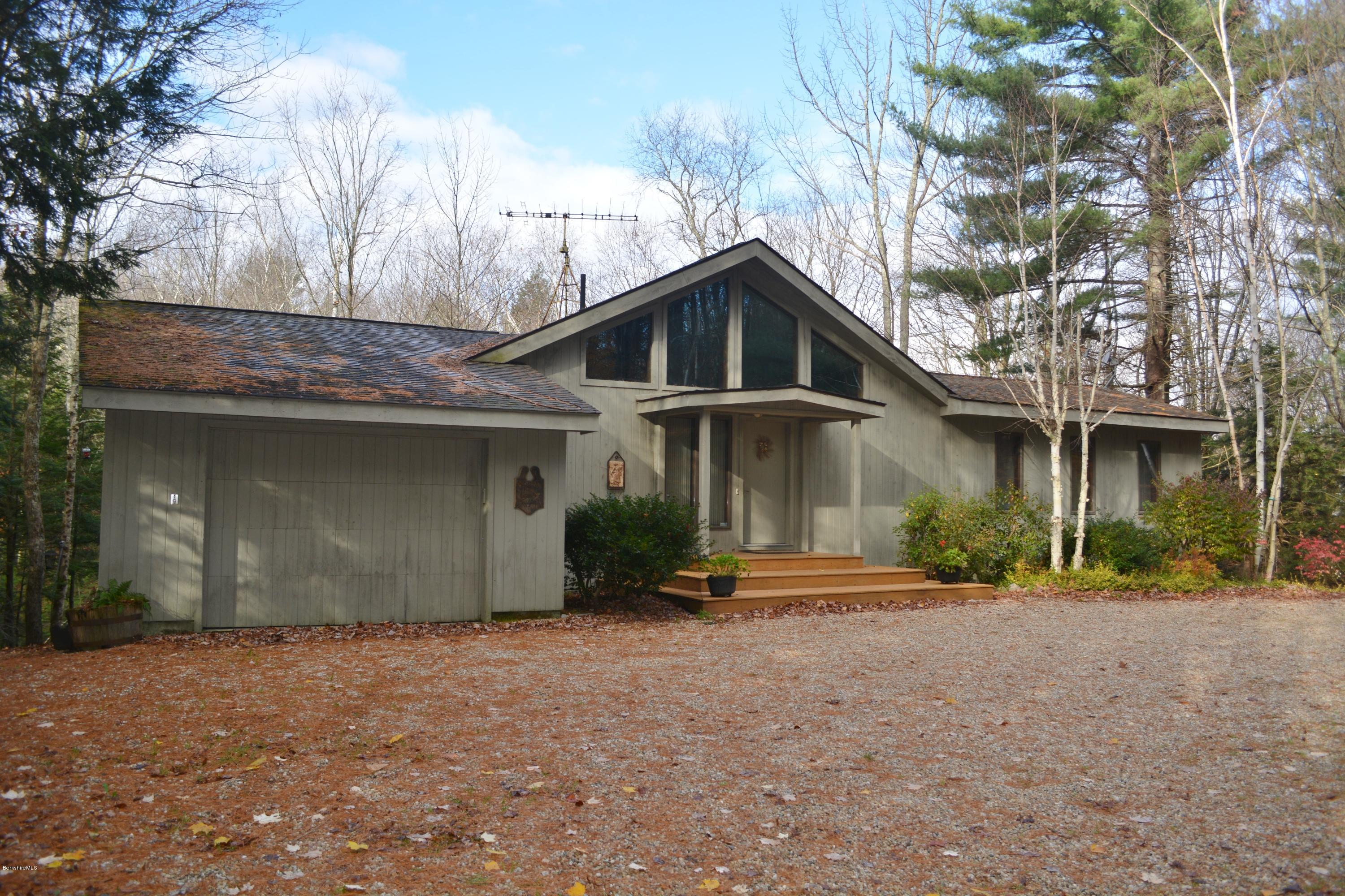 138 Bonny Rigg Hill Road Becket, MA 01223 - Photo 2 of 39 a front view of a house with a yard