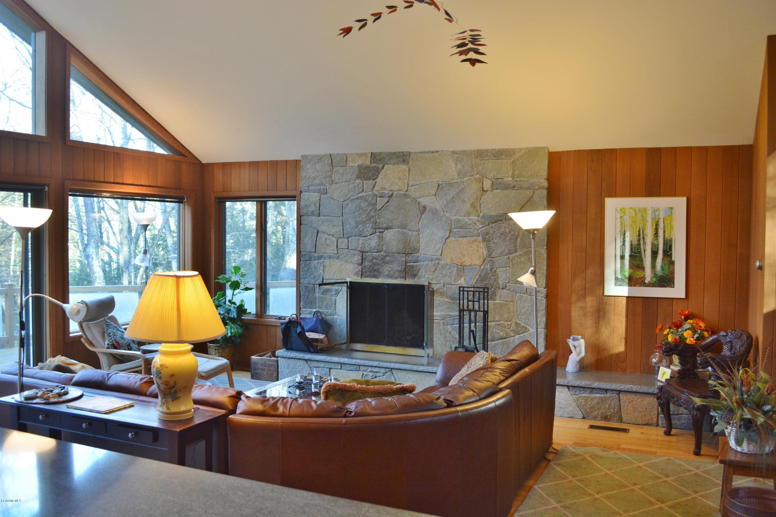 138 Bonny Rigg Hill Road Becket, MA 01223 - Photo 15 of 39 a living room with furniture and a fireplace