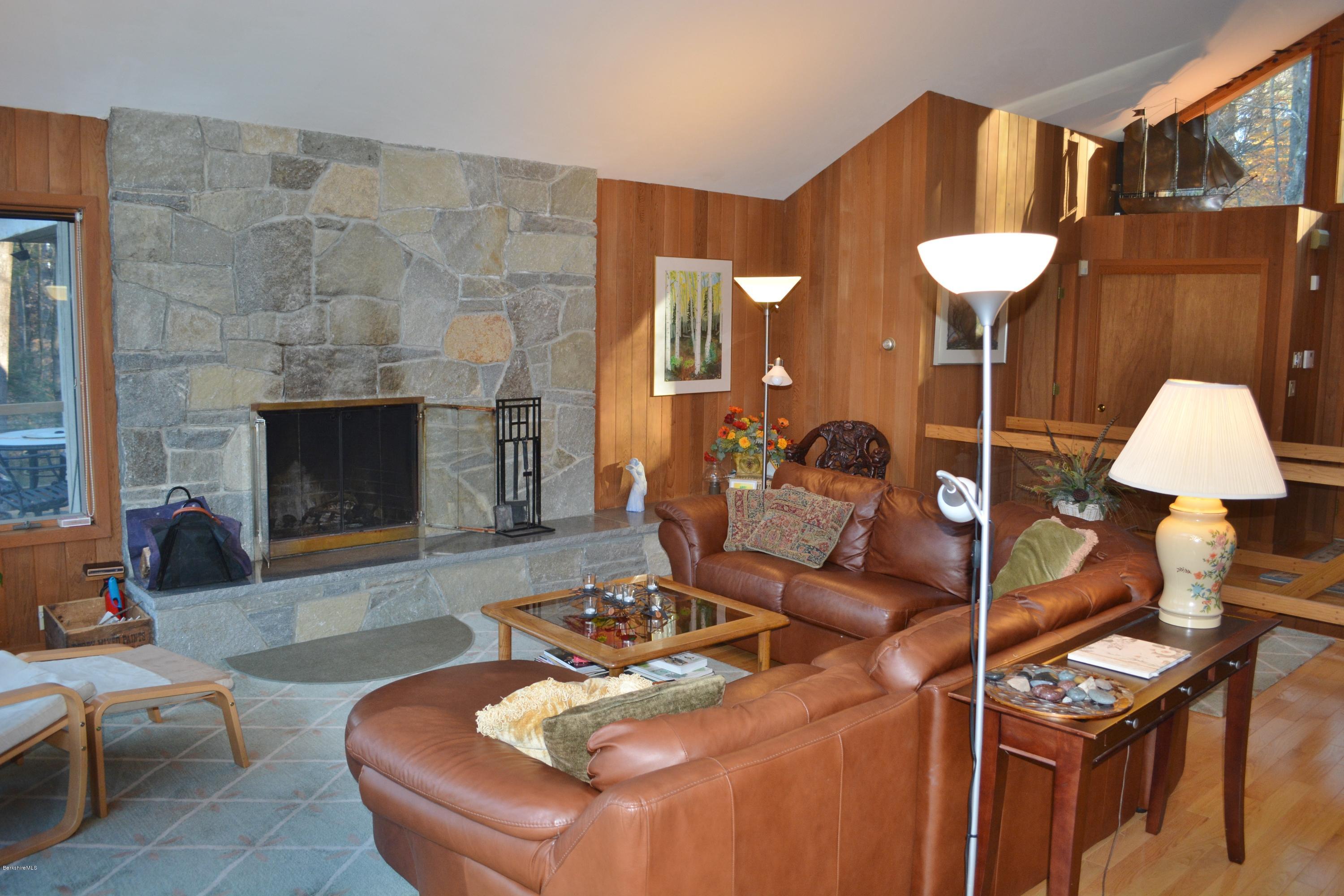 138 Bonny Rigg Hill Road Becket, MA 01223 - Photo 16 of 39 a living room with furniture and a fireplace