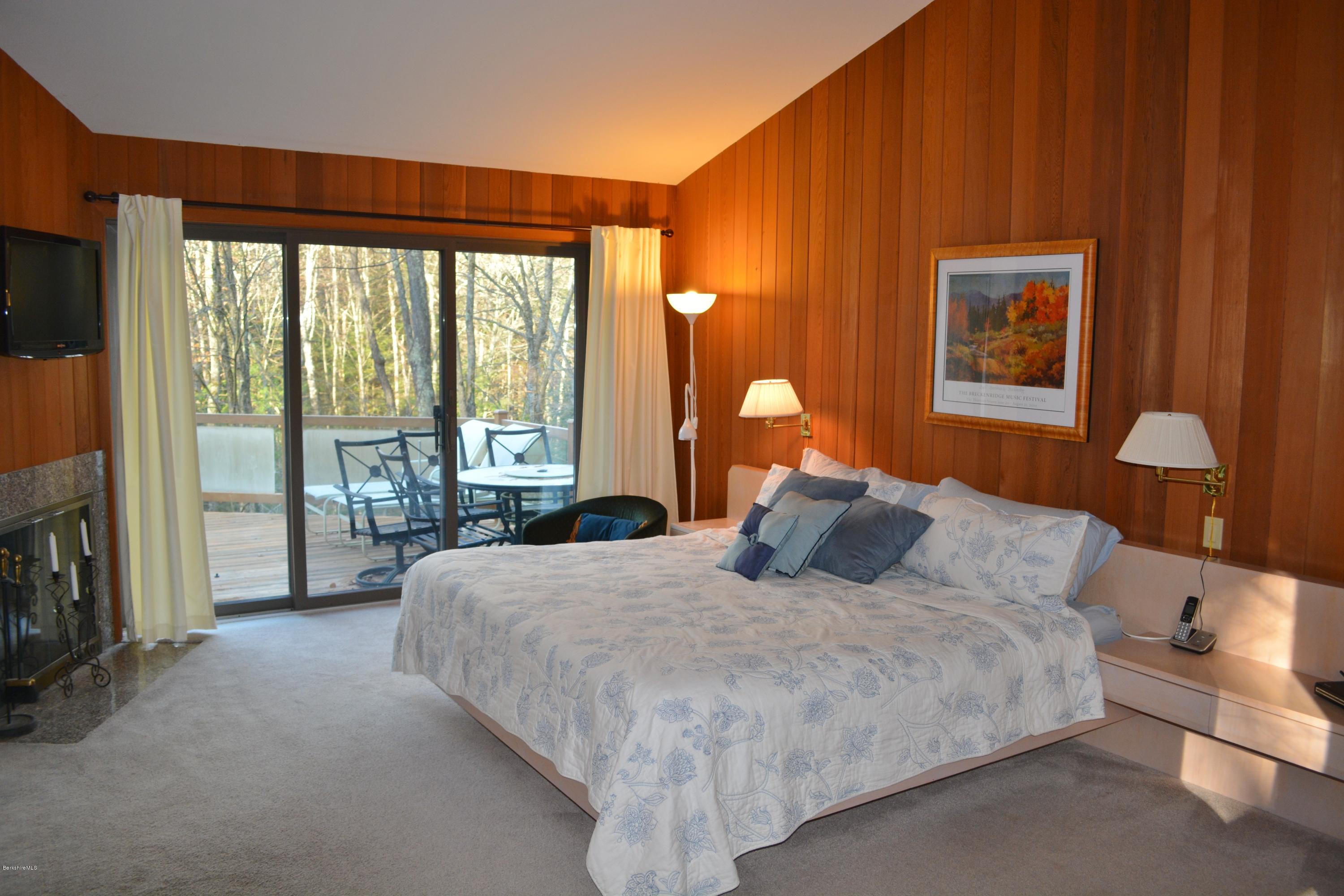 138 Bonny Rigg Hill Road Becket, MA 01223 - Photo 19 of 39 a bedroom with a large bed and a large window