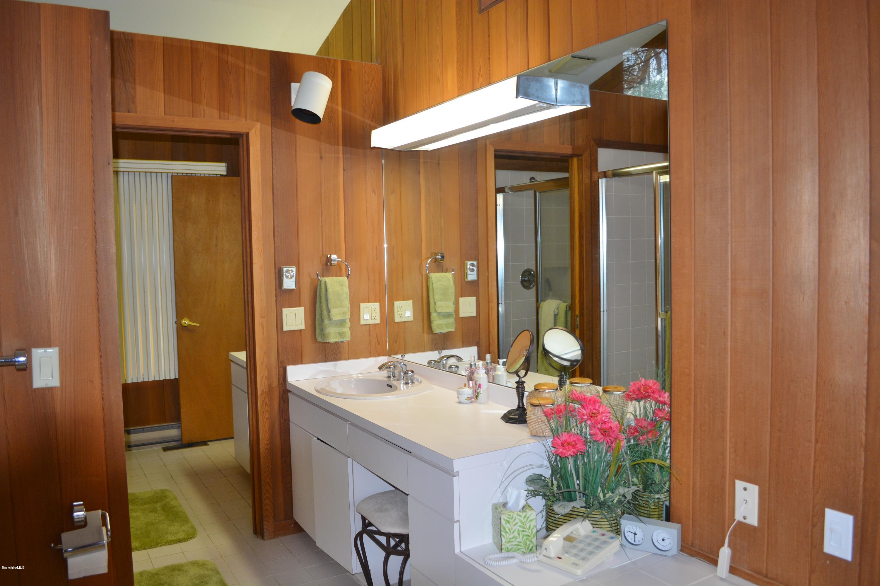 138 Bonny Rigg Hill Road Becket, MA 01223 - Photo 23 of 39 a bathroom with a sink and a mirror