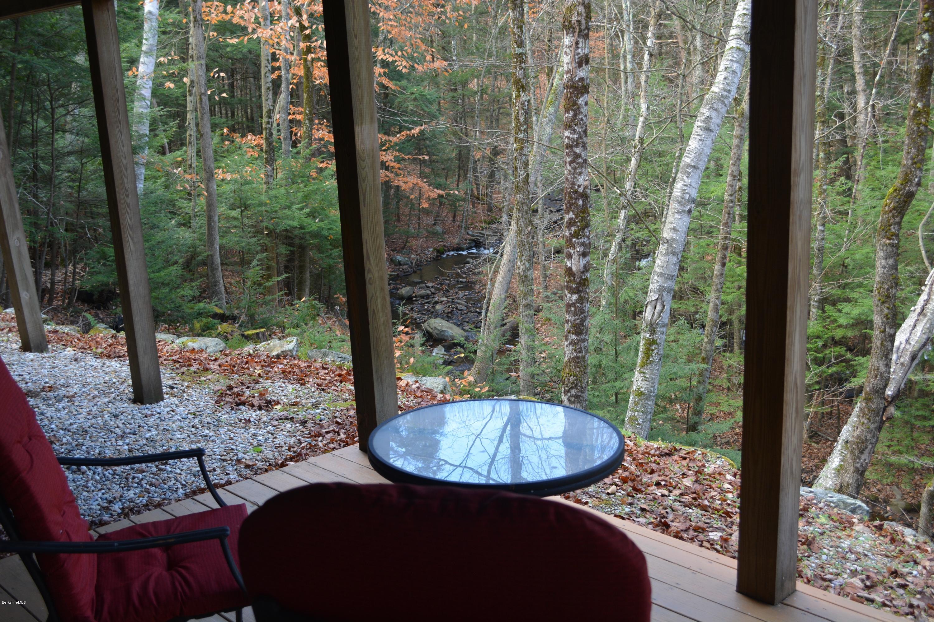 138 Bonny Rigg Hill Road Becket, MA 01223 - Photo 31 of 39 a view of a balcony with table and chairs