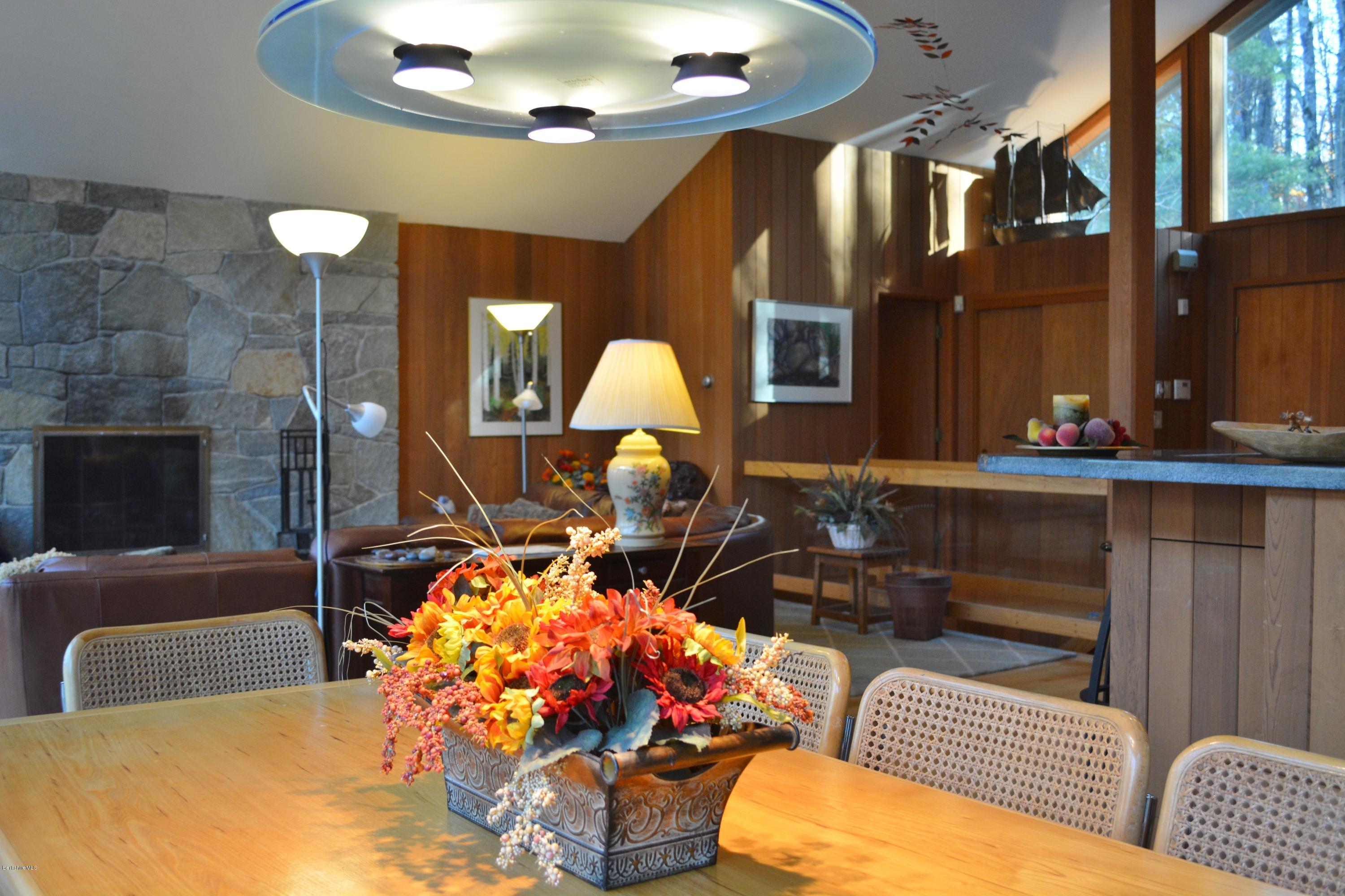 138 Bonny Rigg Hill Road Becket, MA 01223 - Photo 7 of 39 a living room with furniture a lamp and a fireplace