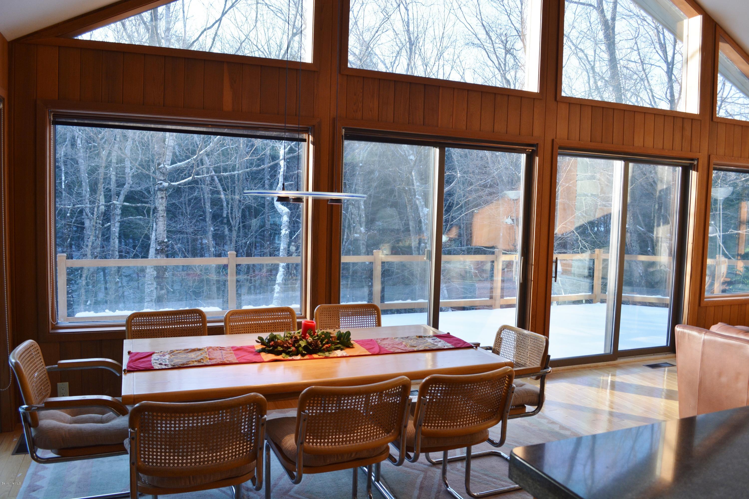 138 Bonny Rigg Hill Road Becket, MA 01223 - Photo 10 of 39 a dining room with furniture and a floor to ceiling window