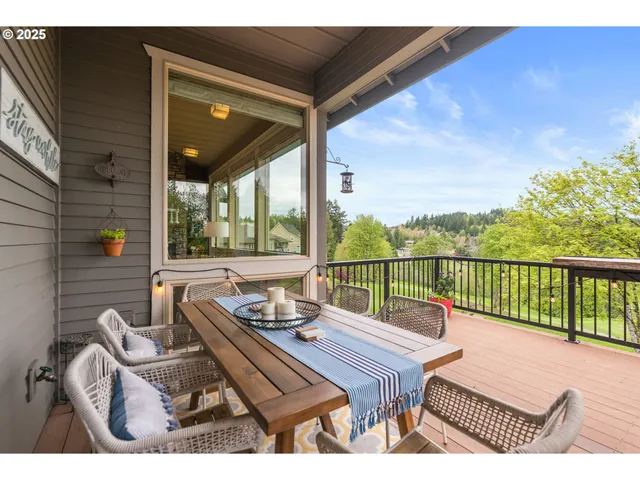 a view of a balcony with couch and wooden floor