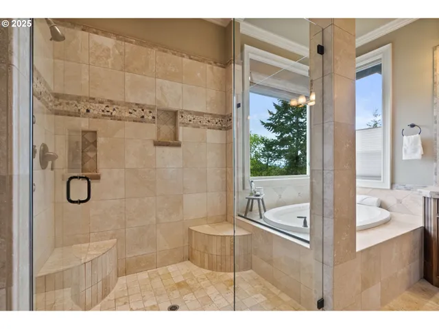 a bathroom with a tub shower and sink