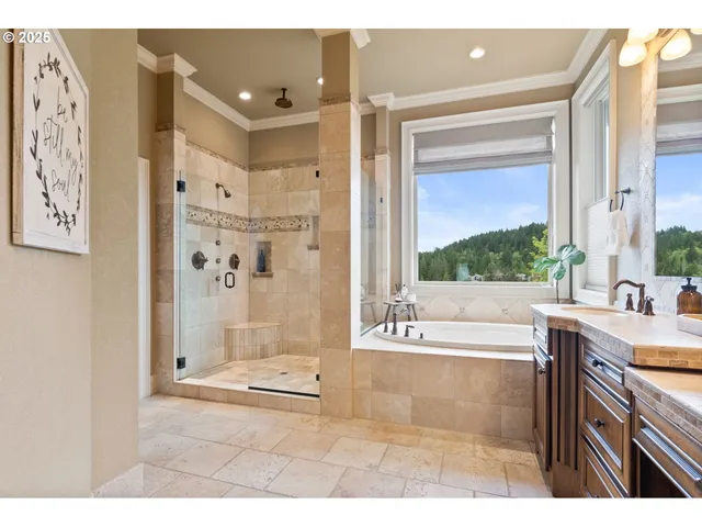 a bathroom with a tub sink and mirror