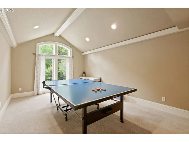 a view of a room with furniture and window