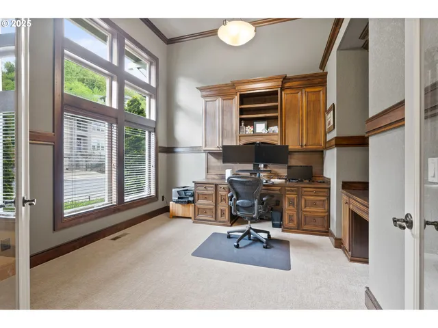a workspace with furniture and a window