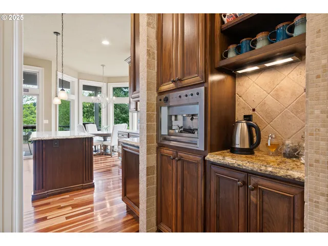 a view of living room with furniture and floor to ceiling window