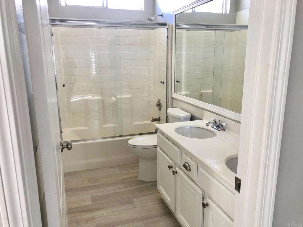 130 Venetia Way Oceanside, CA 92057 - Photo 12 of 19 a bathroom with a sink a toilet and shower