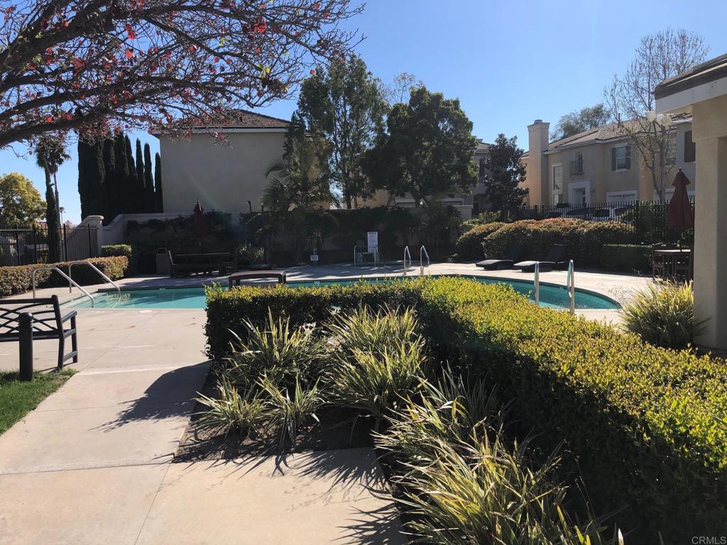 130 Venetia Way Oceanside, CA 92057 - Photo 17 of 19 a view of a swimming pool with a patio and a garden