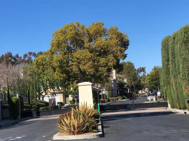 a park view with a fountain and a fire pit