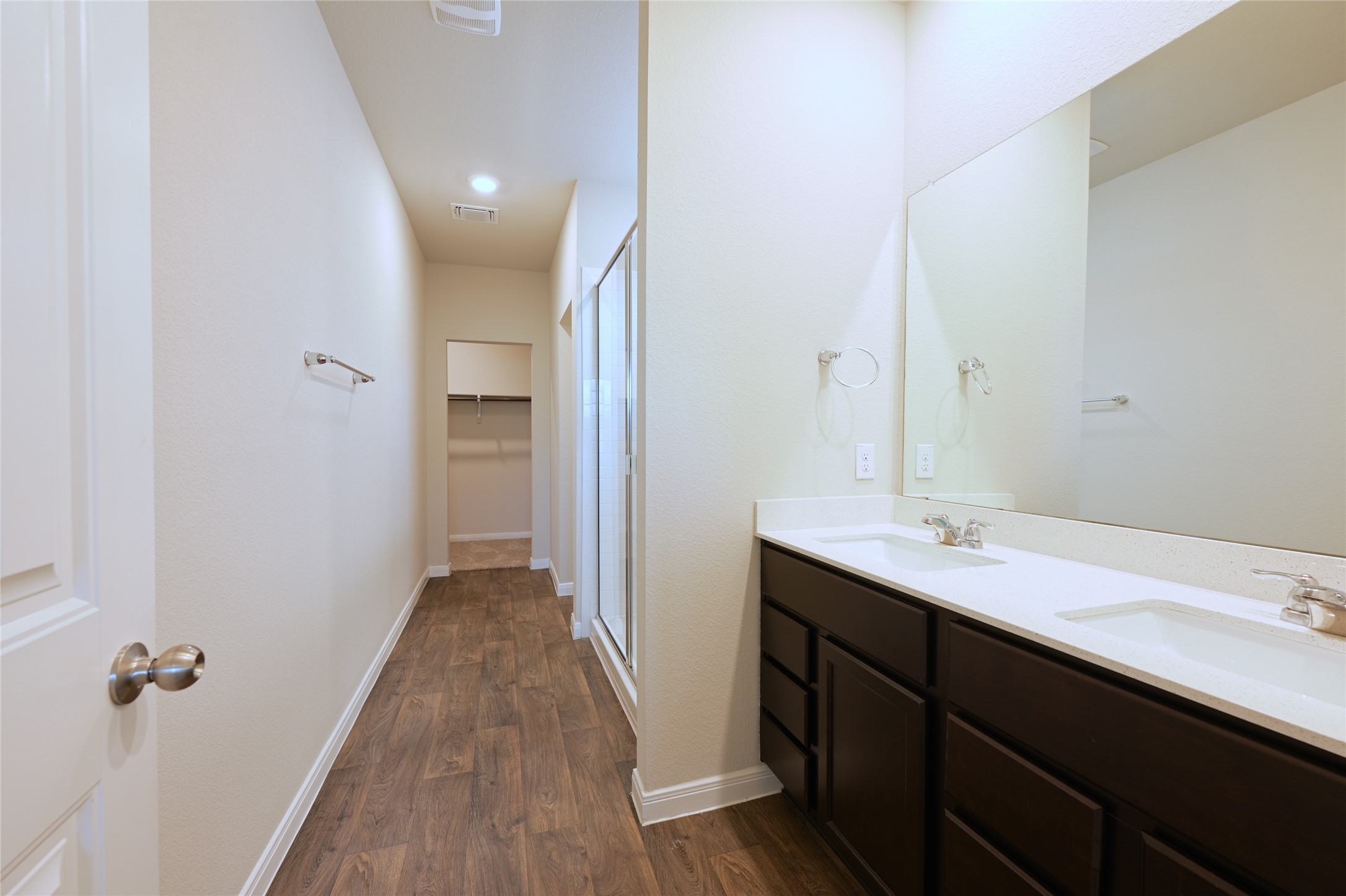 14008 Levy Pflugerville, TX 78660 - Photo 6 of 15 Double vanity and a spacious shower create a highly functional bathroom, a big walk-in-closet at end