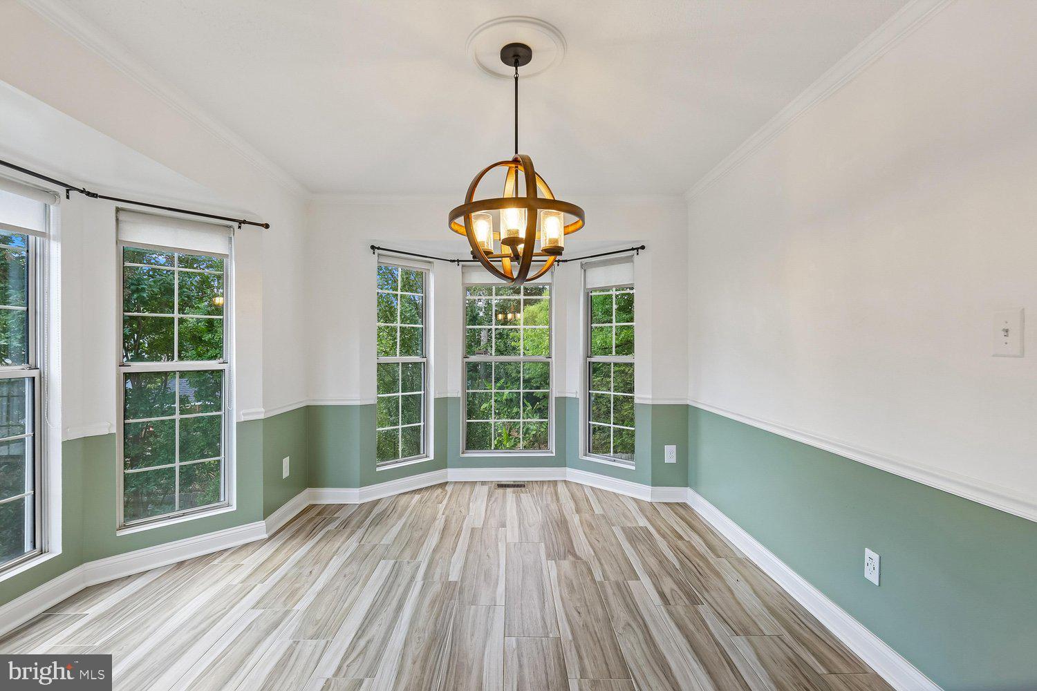 15764 Beau Ridge Drive Woodbridge, VA 22193 - Photo 7 of 58 a view of a room with wooden floor fan and windows