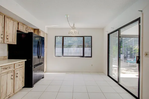 a kitchen with stainless steel appliances a refrigerator and a stove top oven