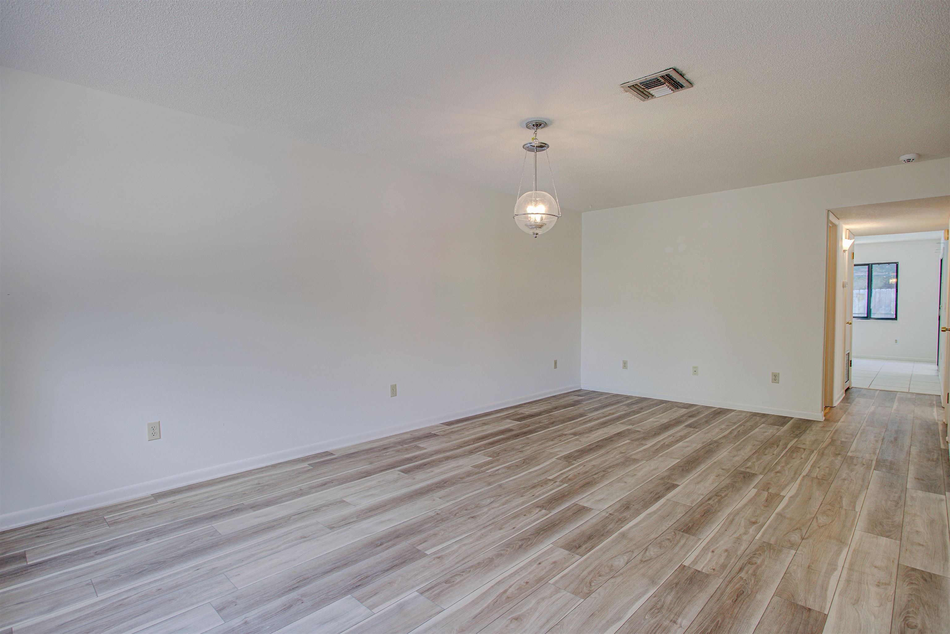 21 Atlantic Oaks Circle St. Augustine, FL 32080 - Photo 10 of 21 a view of empty room with wooden floor