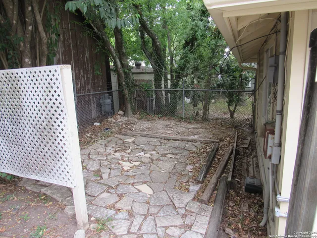 a backyard of a house with lots of green space