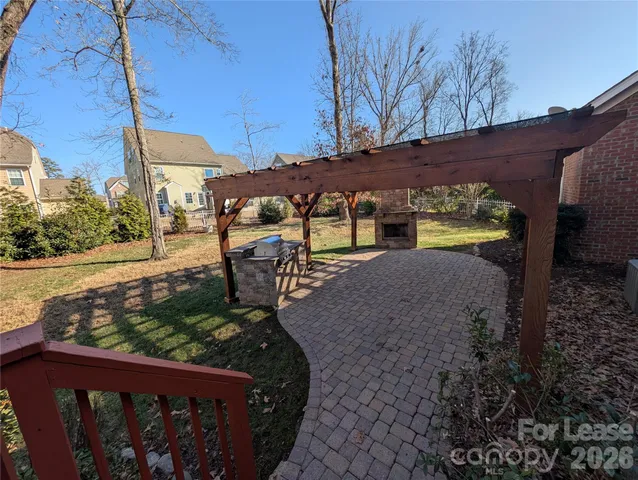 a view of a patio with a table and chairs