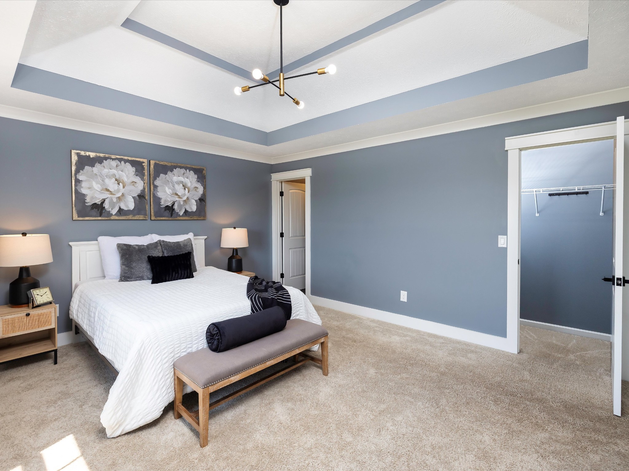 154 County Line Road Bell Buckle, TN 37020 - Photo 11 of 21 a bedroom with a large bed and a chandelier
