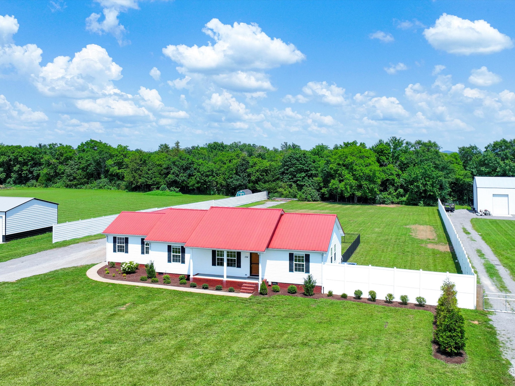 154 County Line Road Bell Buckle, TN 37020 - Photo 2 of 21 a view of pool with garden and trees