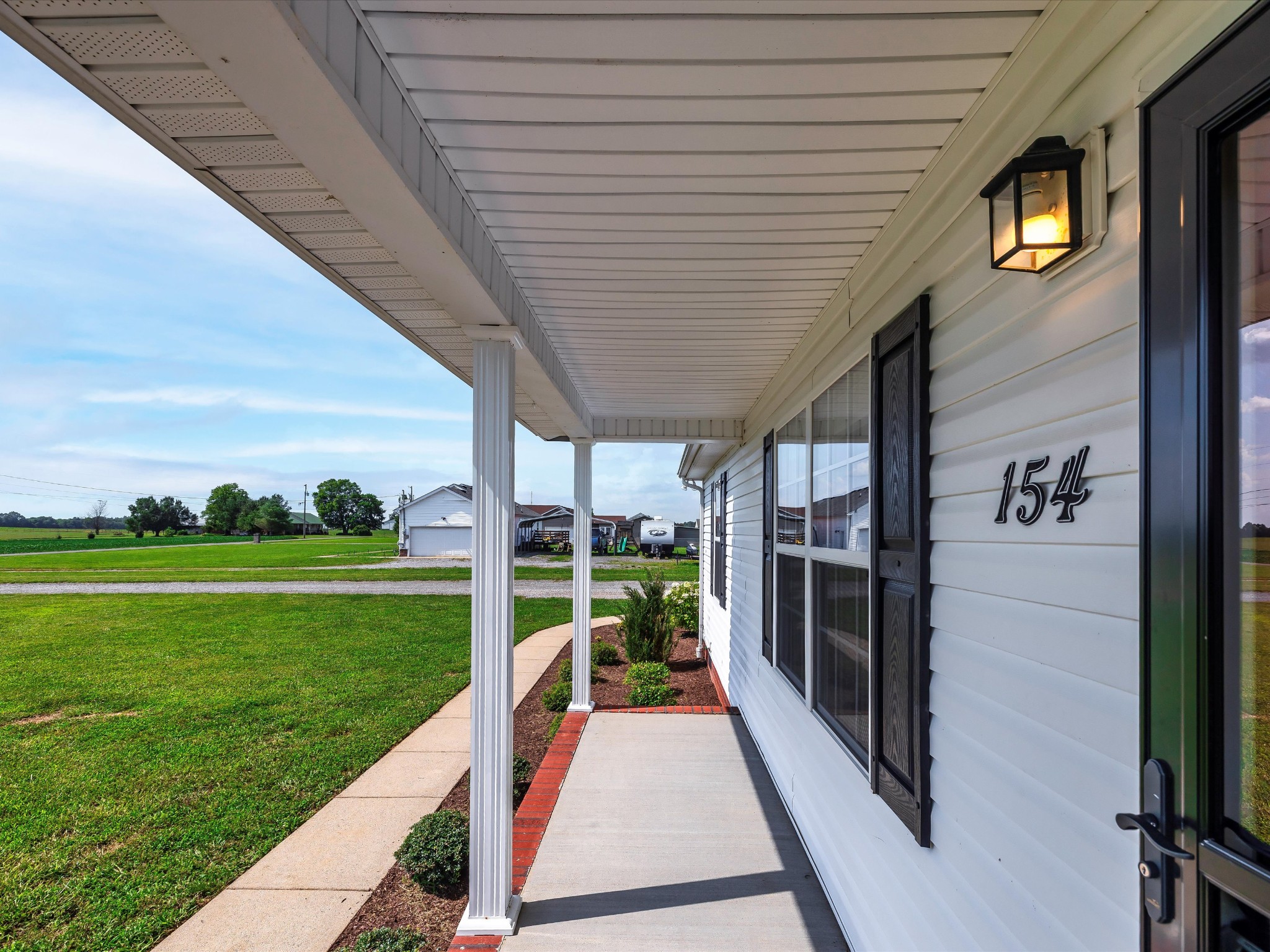154 County Line Road Bell Buckle, TN 37020 - Photo 3 of 21 a view of a porch with furniture and garden