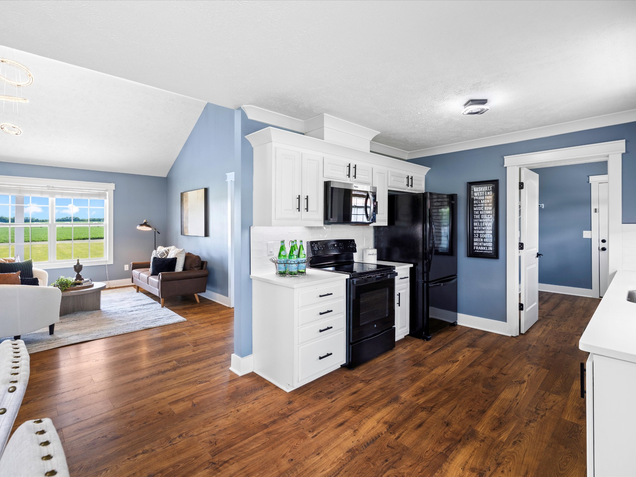 154 County Line Road Bell Buckle, TN 37020 - Photo 6 of 21 a large white kitchen with cabinets a refrigerator and a stove