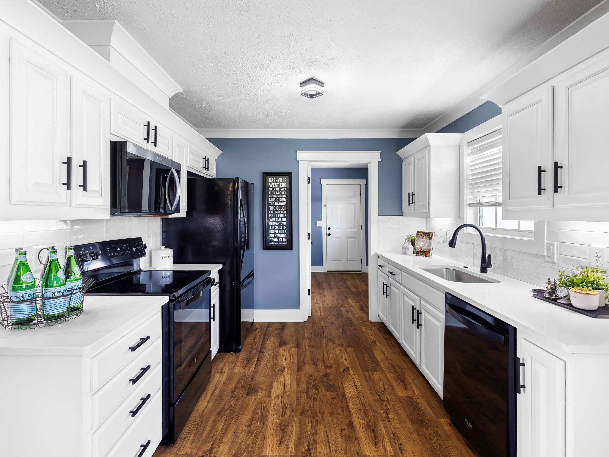 154 County Line Road Bell Buckle, TN 37020 - Photo 8 of 21 a open kitchen with stainless steel appliances granite countertop a sink dishwasher stove and refrigerator