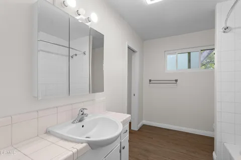a bathroom with a sink and a mirror