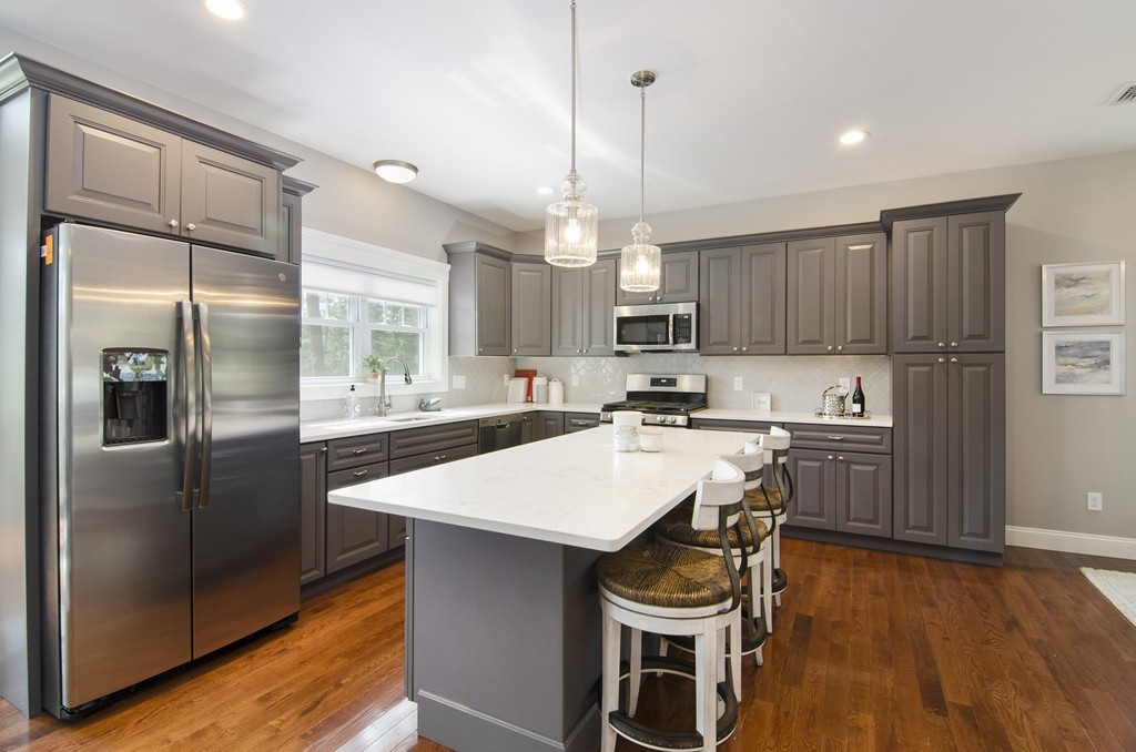 42 Cahoon Road, Unit LOT 5 Wareham, MA 02532 - Photo 4 of 16 a kitchen with a refrigerator a sink and cabinets