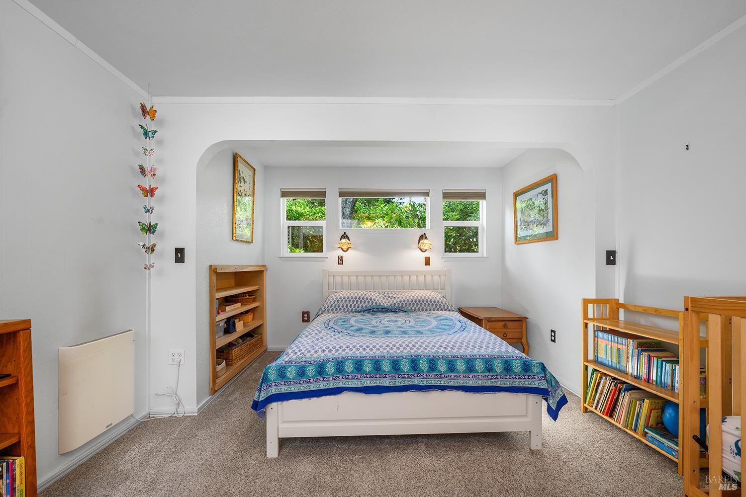 7350 Fircrest Avenue Sebastopol, CA 95472 - Photo 13 of 33 Mail level bedroom with front garden area view.