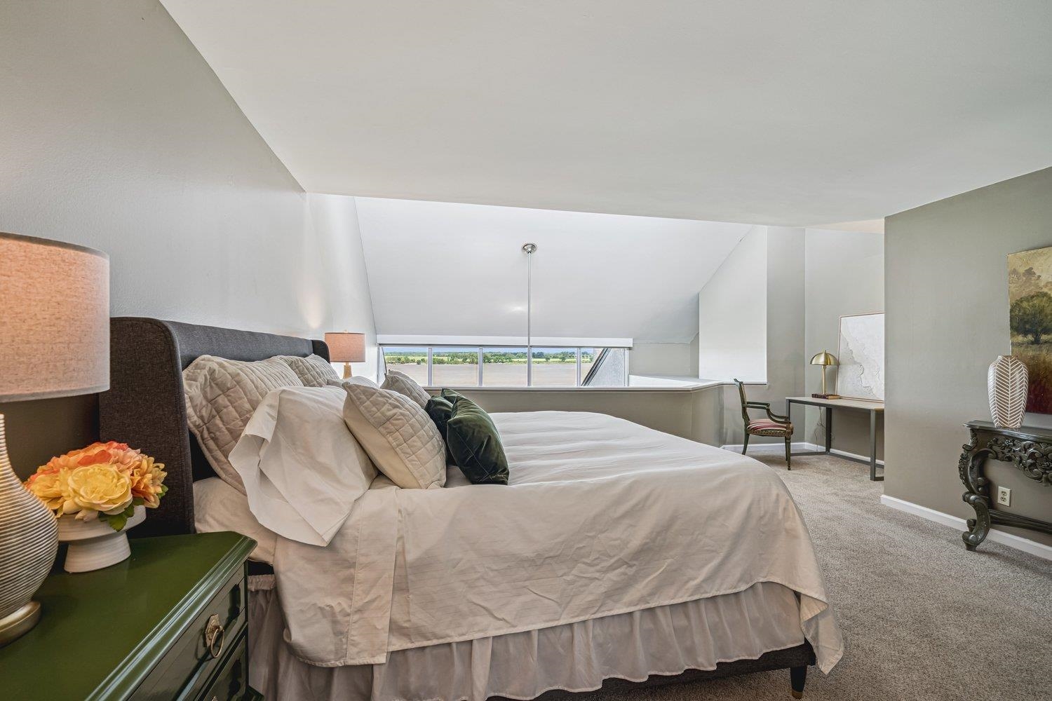 335 Riverbluff Place, Unit 2 Memphis, TN 38103 - Photo 11 of 21 a bedroom with furniture and a bed