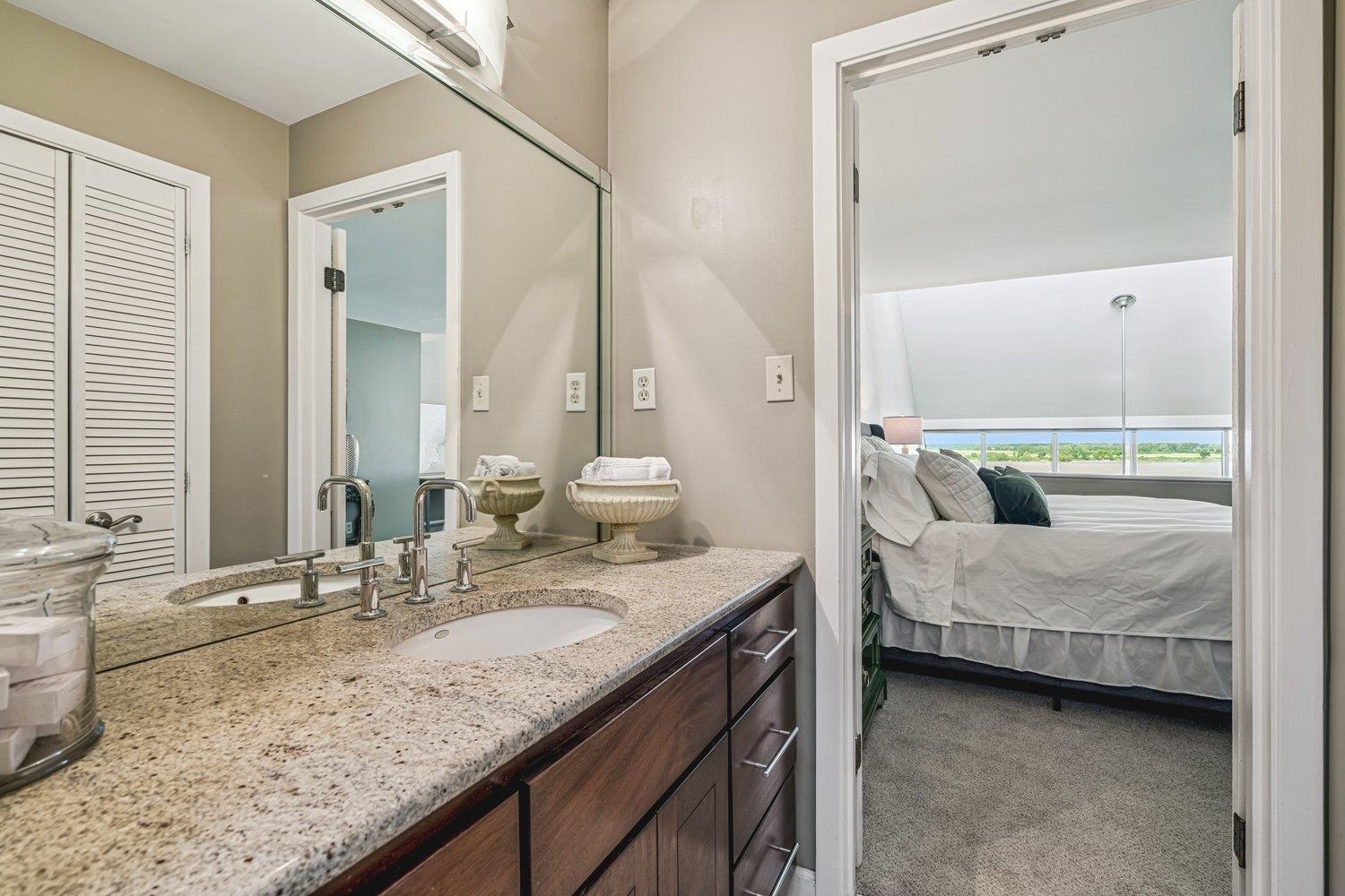 335 Riverbluff Place, Unit 2 Memphis, TN 38103 - Photo 12 of 21 a en suite bathroom with a granite countertop sink and a mirror