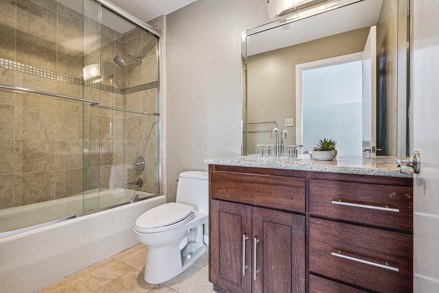 335 Riverbluff Place, Unit 2 Memphis, TN 38103 - Photo 16 of 21 a bathroom with a sink a toilet and shower