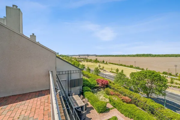 a terrace with outdoor seating and city view